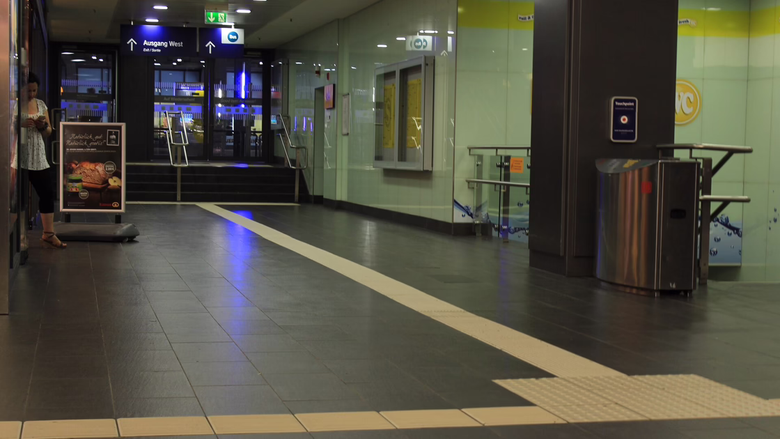 The entire station was covered in dark-green and light beige floor tiles 