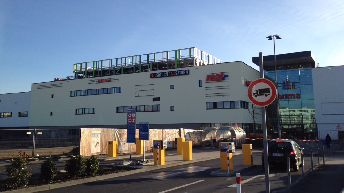 Exterior view of the shopping centre with entrance to the underground car park.